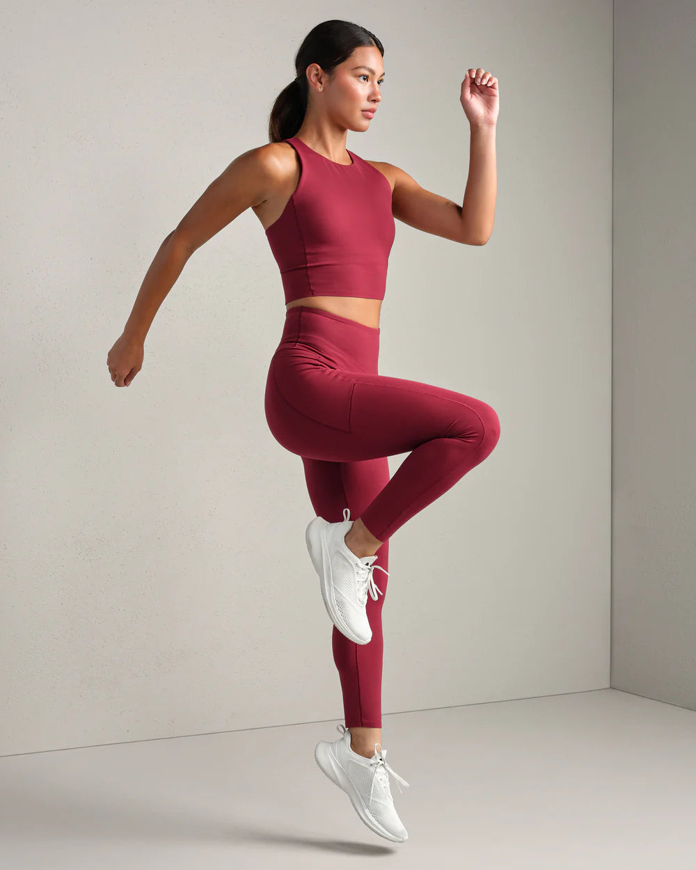 Rhone Revive 7/8 Pocket Legging in Cranberry at Baseline Social