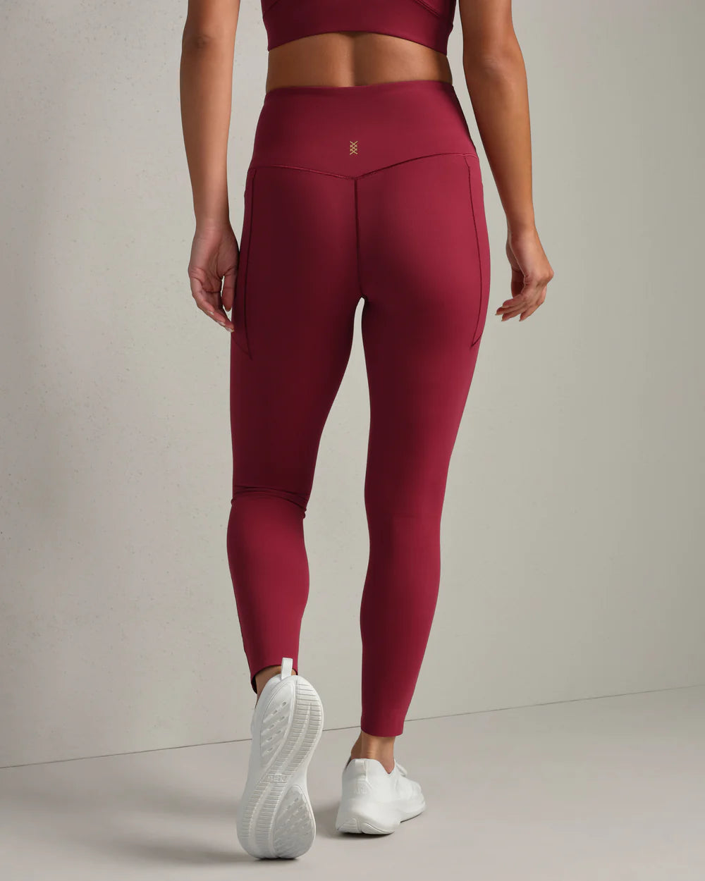 Rhone Revive 7/8 Pocket Legging in Cranberry at Baseline Social