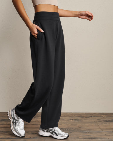 Rhone DreamGlow Barrel Leg Pant in Pure Black Heather at Baseline Social