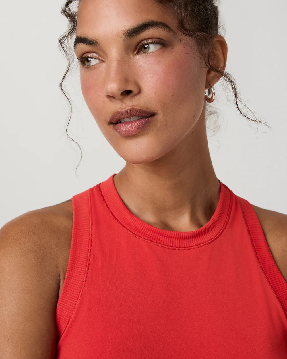Vuori Surge Seamless Tank in Crimson Red at Baseline Social