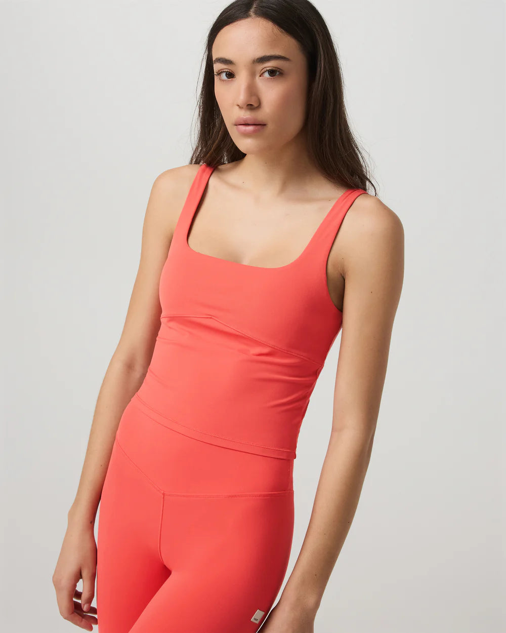 Vuori AllTheForm Tank in Bright Coral at Baseline Social