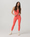 Vuori AllTheForm Tank in Bright Coral at Baseline Social