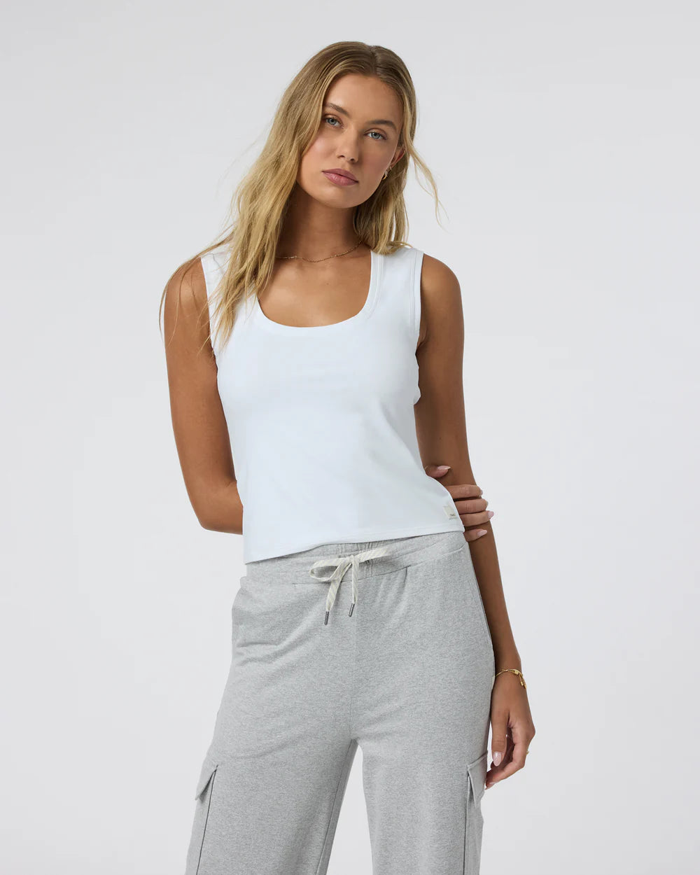 Vuori Halo Essential Scoop Tank in White at Baseline Social