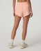 Vuori Daily Speed Short 2.5" in Light Peach at Baseline Social