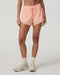 Vuori Daily Speed Short 2.5" in Light Peach at Baseline Social