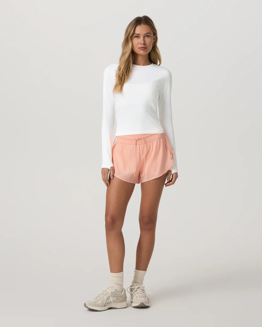 Vuori Daily Speed Short 2.5" in Light Peach at Baseline Social