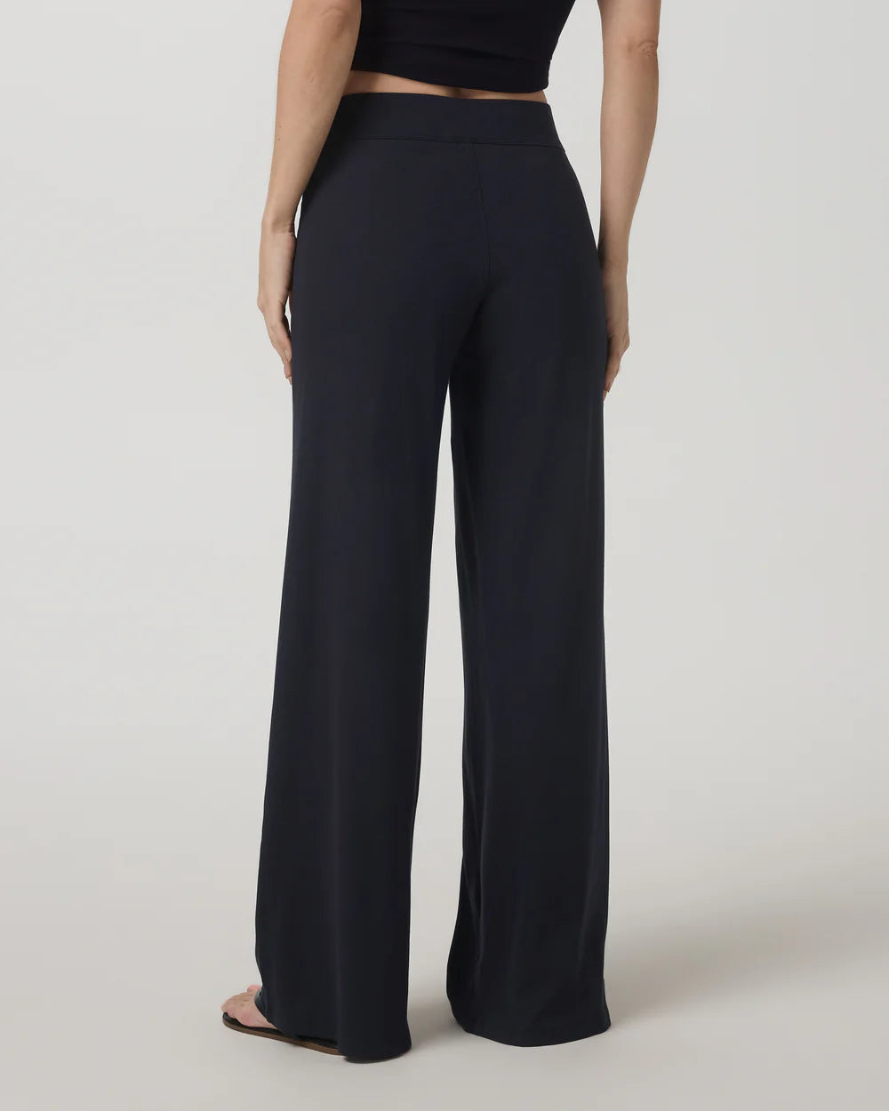 Vuori Pose Wideleg Pant in Black at Baseline Social