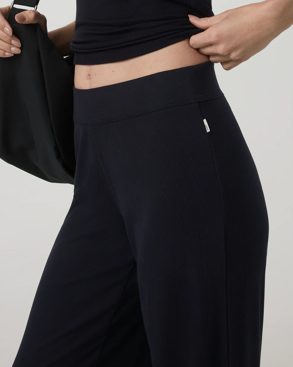 Vuori Pose Wideleg Pant in Black at Baseline Social