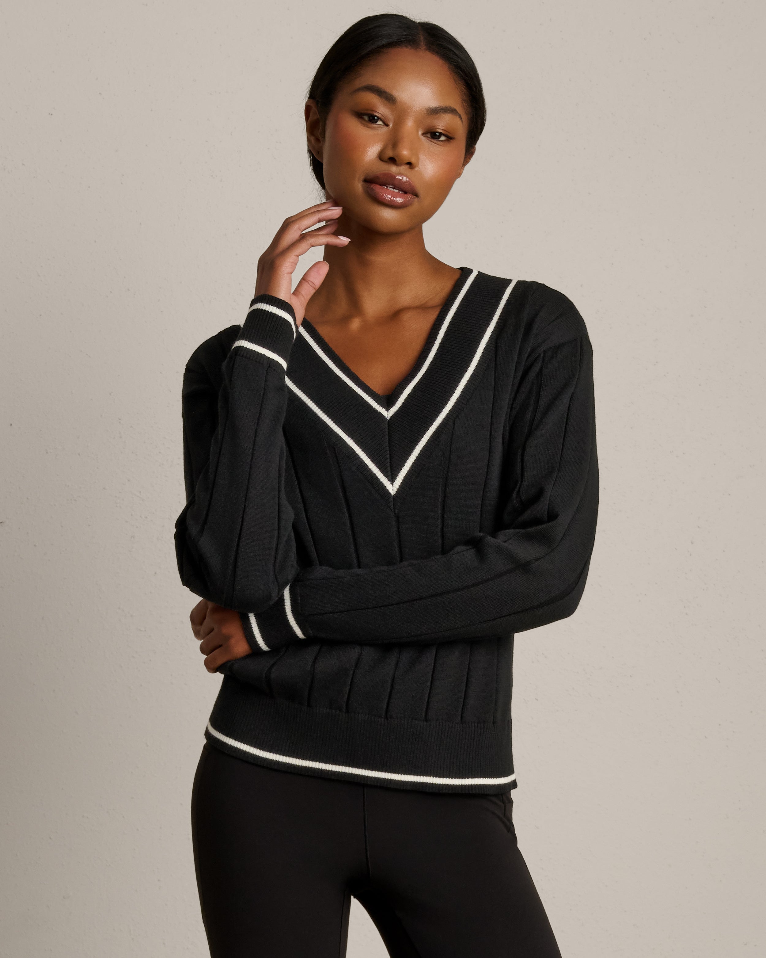 Rhone Varsity Cable Knit Sweater in Pure Black at Baseline Social