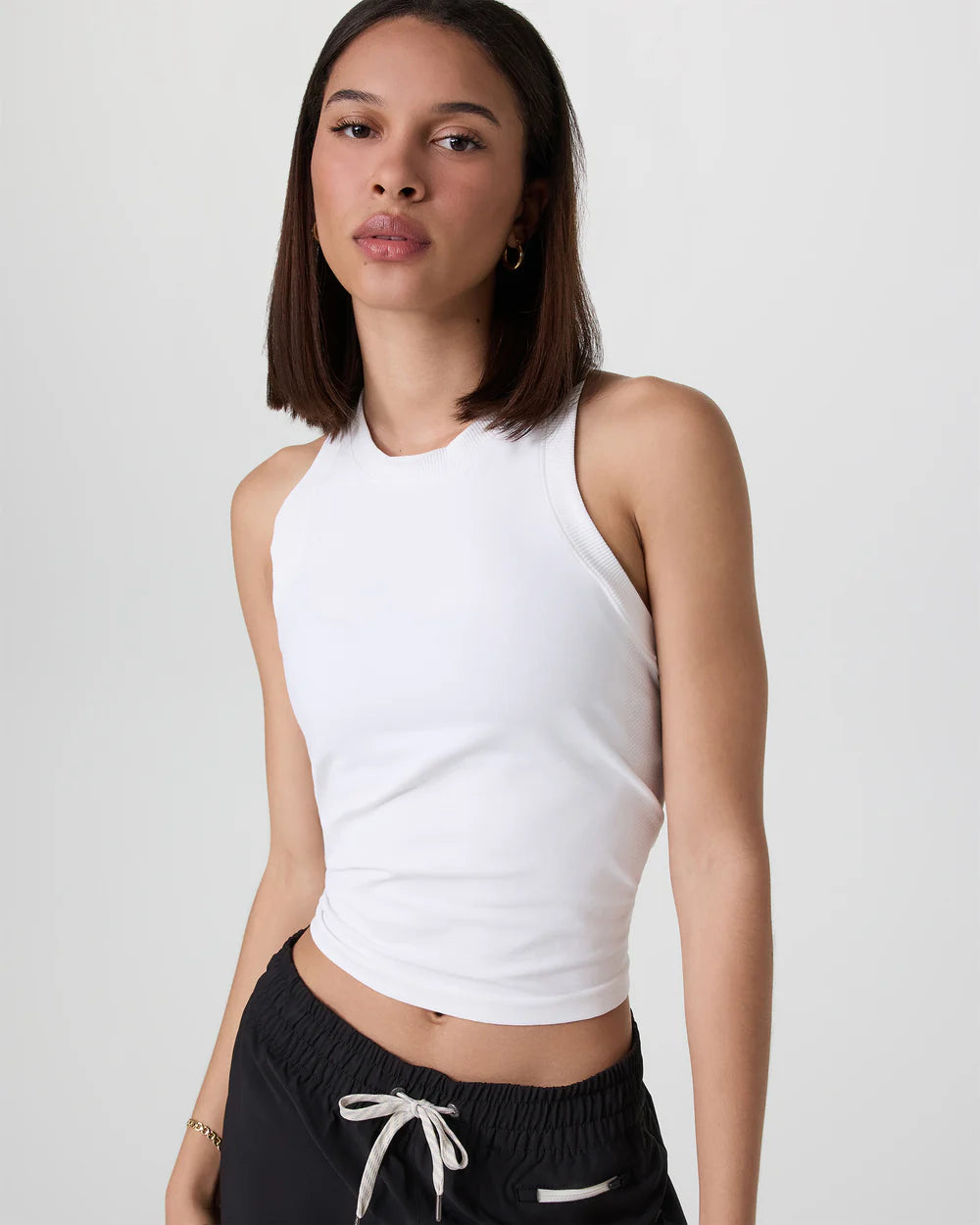 Vuori Surge Seamless Tank in White at Baseline Social